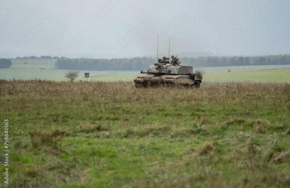Naklejka premium British army Challenger 2 II FV4034 main battle tank in action on a military exercise, taking aim