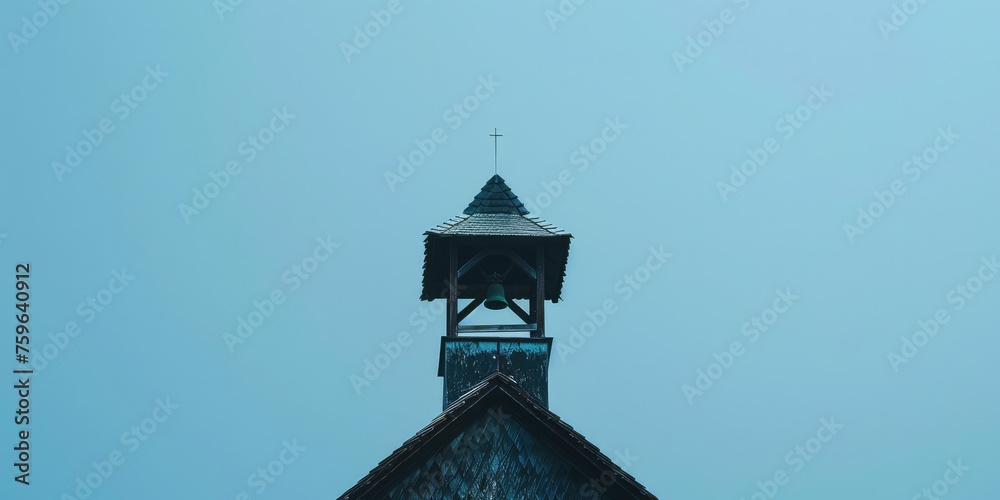 Old Retro Bell Tower Against Blue Sky background with copy space. Orthodox bell tower of a traditional church with cross on top. Bell ringing, the work of the bell ringer. Old Retro Bell Tower Against Blue Sky background with copy space. Orthodox bell tower of a traditional church with cross on top. Bell ringing, the work of the bell ringer.