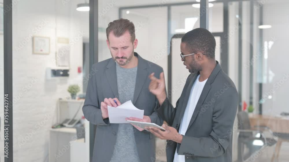 Business People Talking with Each Other while Standing in Office Business People Talking with Each Other while Standing in Office