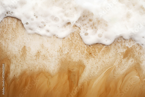 Foamy white waves gently wash over the sandy shore,creating a gentle gradient where the sea meets the land.The foam bubbles as the sand reveals the pattern of the water flow.Background concept.AI gene