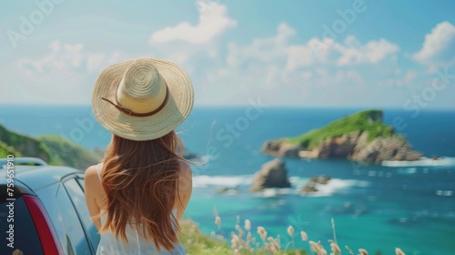 Young woman in straw hat standing against car and looking at sea view from a high cliff, Travel concept for a summer vacation or holiday trip with young people in the vehicle in the style of sea.