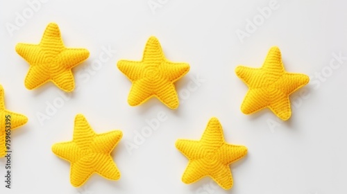 Knitted stars on a monochrome colored background, top view, with space for text. Greeting card, hobby, knitting, children's toy.