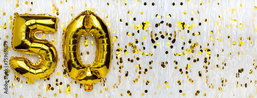 Golden foil balloon number, figure fifty on white with confetti background. 50th birthday card. Anniversary concept. birthday, new year celebration. banner