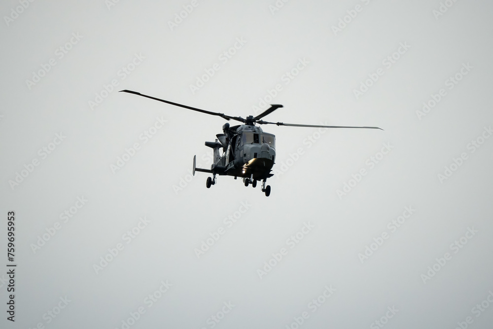 British army AgustaWestland AW159 Wildcat AH1 helicopter in low level flight, Wilts UK