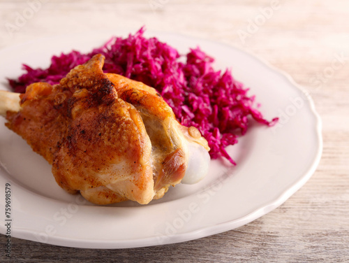 Roast turkey wing over red cabbage salad