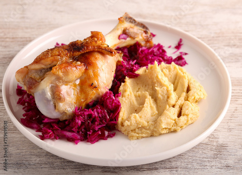 Roast turkey wing over red cabbage salad