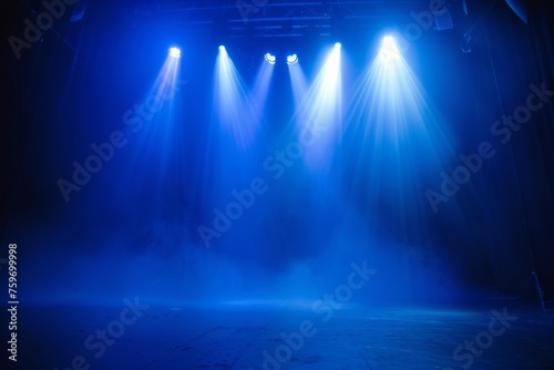 Spotlights illuminate empty stage blue background