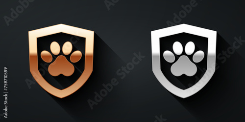 Gold and silver Animal health insurance icon isolated on black background. Pet protection concept. Dog or cat paw print. Long shadow style. Vector