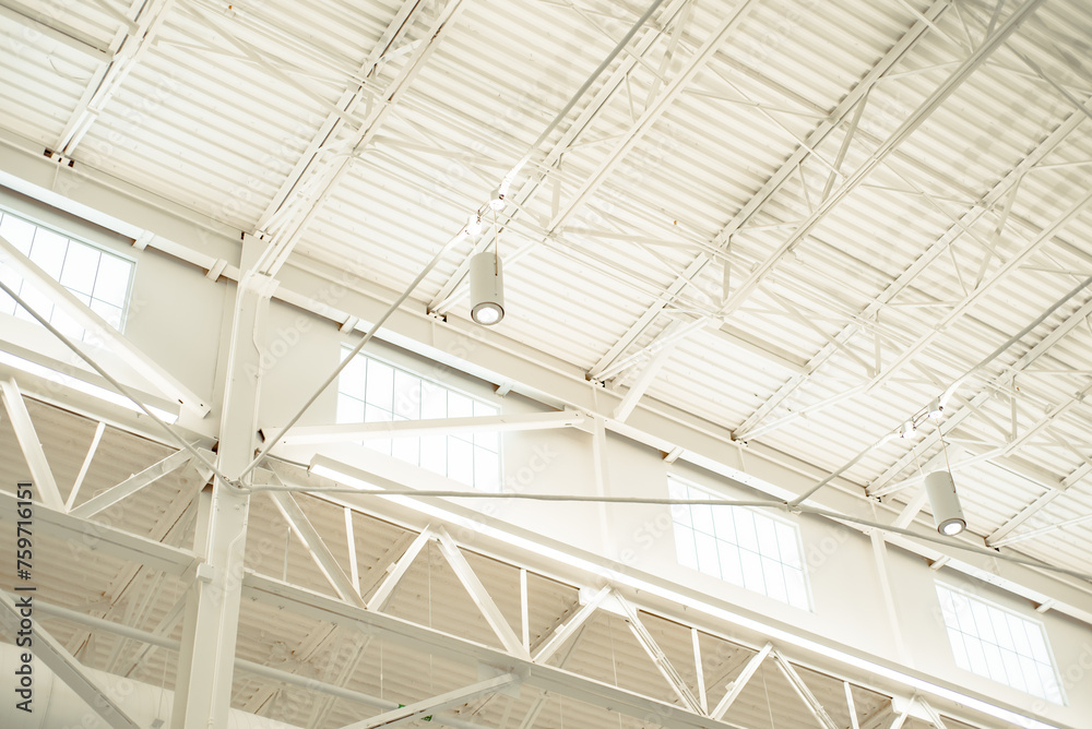 Tall warehouse style building with large windows for natural light and modern roof beam spot LED lights, suspended ceiling metal roof structure, steel warehouse industry factory building, Texas Tall warehouse style building with large windows for natural light and modern roof beam spot LED lights, suspended ceiling metal roof structure, steel warehouse industry factory building, Texas