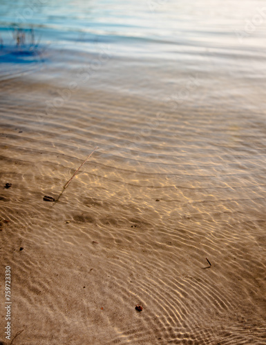 Gentle waves on the beach with golden sand © Joanna