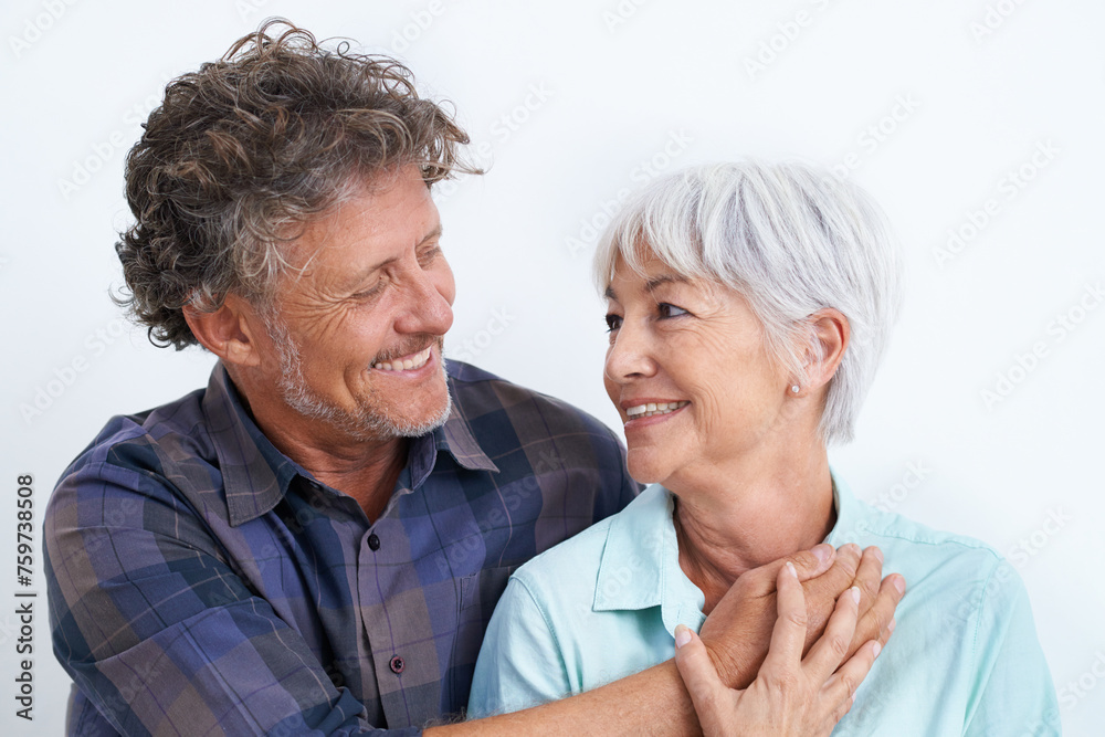 Old couple, smile with happiness and love in studio, hug and security with comfort for bonding. Marriage partner, retirement and connection with people for trust and loyalty on white background Old couple, smile with happiness and love in studio, hug and security with comfort for bonding. Marriage partner, retirement and connection with people for trust and loyalty on white background