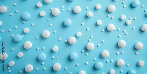 blue and white pills scattered on a blue background