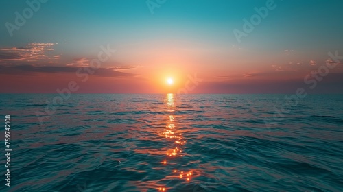 sunset on the horizon, with the sun casting a warm glow over the sky and the sea