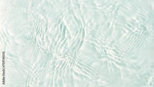 slow motion transparent rippled water surface texture from above, concept with copy space for travel, beauty care and beach vacation