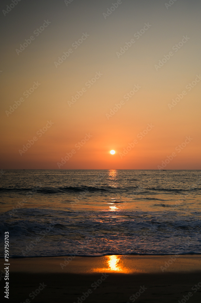Beach Sunset in Playa Zicatela, Puerto Escondido, Oaxaca, Mexico - Bright Deep Orange Sunset over waves at the beach by the Pacific Ocean Beach Sunset in Playa Zicatela, Puerto Escondido, Oaxaca, Mexico - Bright Deep Orange Sunset over waves at the beach by the Pacific Ocean