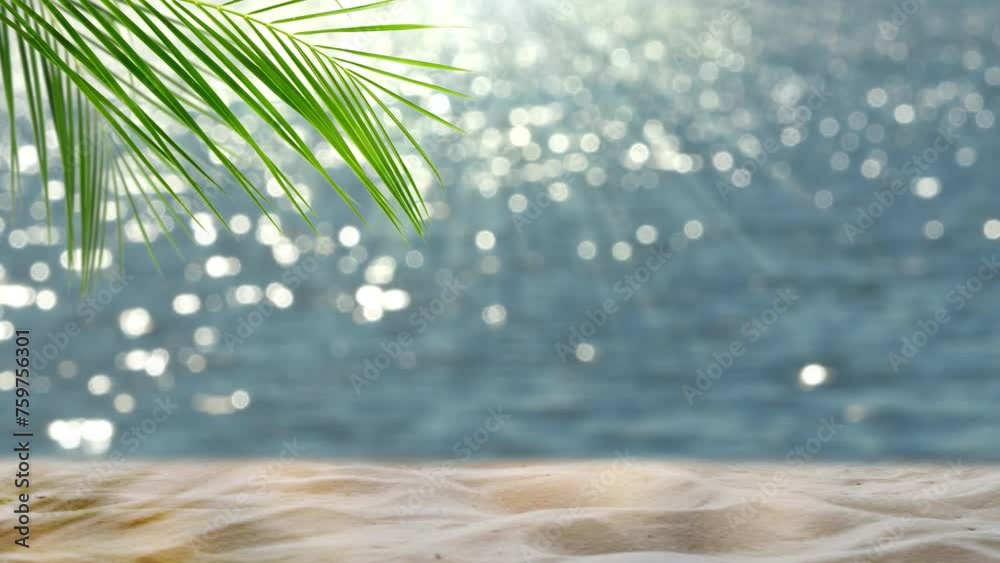 fresh green palm leaf and white sand on blurred glittering bokeh light water background, beautiful idyllic sand beach backdrop with product display for summer vacation, travel and relaxation outdoors