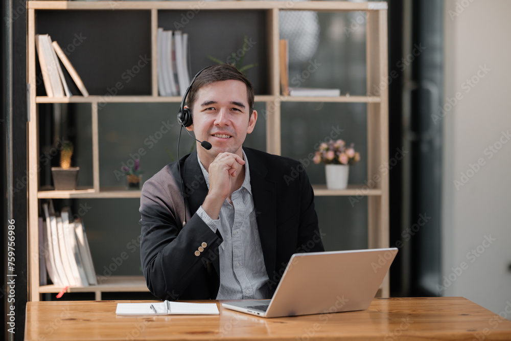 Handsome well dressed businessman working at his office, businessman working on a project Handsome well dressed businessman working at his office, businessman working on a project