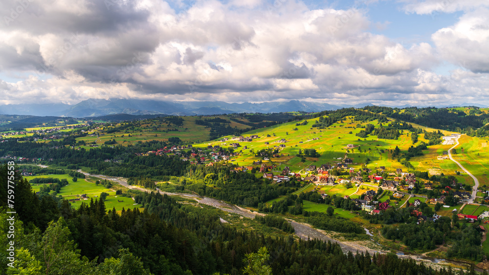 Tatra Mountains, Poland. Panorama of a mountain landscape. Late summer mountain view	with village and river