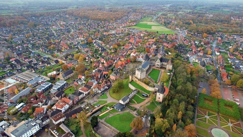 Aerial of the old town around the city Bad Bentheim in Germany on a cloudy noon in fall 
