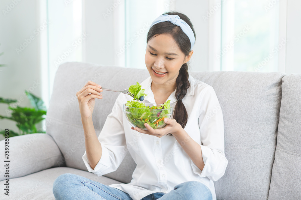 Diet, Dieting pretty attractive asian young woman, girl use fork at lettuce on mix vegetables, green salad bowl, eat food is low fat to good body. Nutritionist female, Weight loss for healthy person. Diet, Dieting pretty attractive asian young woman, girl use fork at lettuce on mix vegetables, green salad bowl, eat food is low fat to good body. Nutritionist female, Weight loss for healthy person.