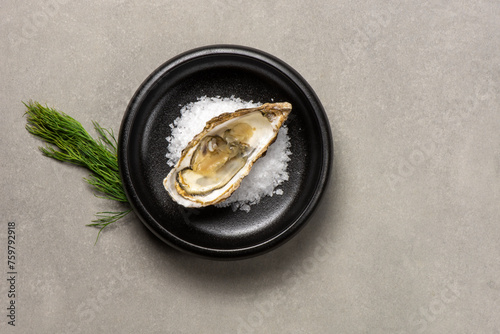 Half shell shucked oysters on a bed of salt