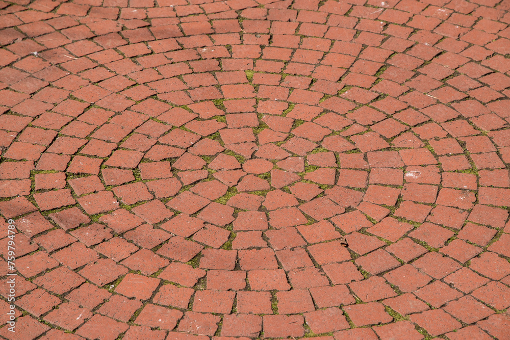 Paving in park of red brick ceramic pavers closeup as background Paving in park of red brick ceramic pavers closeup as background