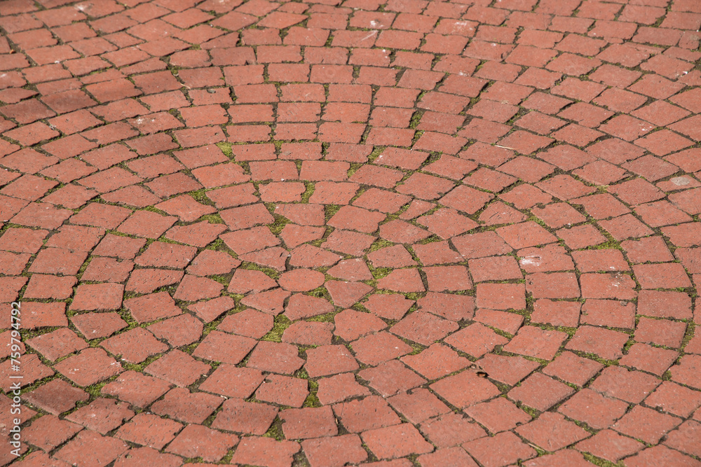 Paving in park of red brick ceramic pavers closeup as background Paving in park of red brick ceramic pavers closeup as background