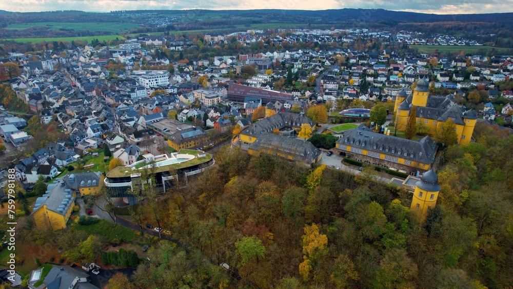 Aerial of the old town around the city Montabauer in Germany on a cloudy noon in fall
