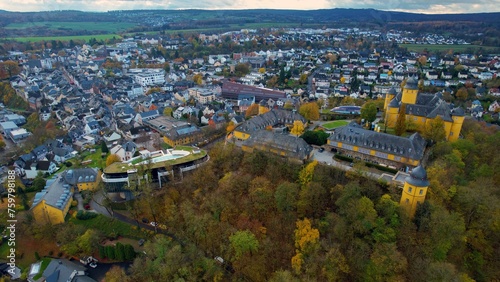 Aerial of the old town around the city Montabauer in Germany on a cloudy noon in fall 