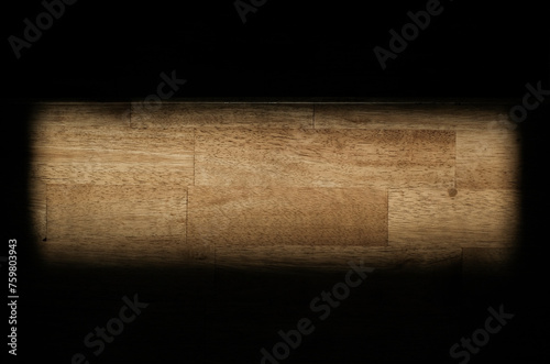 Wooden background in a morning light and shadow from a window frame.