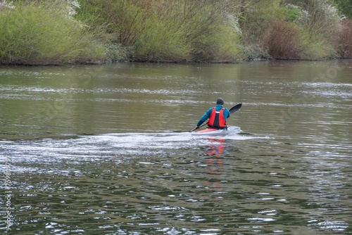 unidentified kayaker on the river
