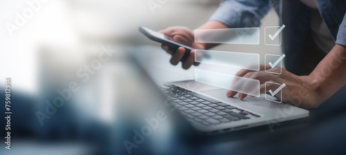 Digital smart checklist and business management concept. Businessman uses laptop to mark paperless office and document management and future business on checklist