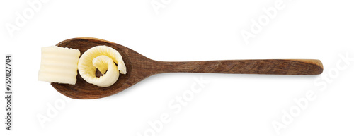 Tasty butter curls in spoon isolated on white, top view