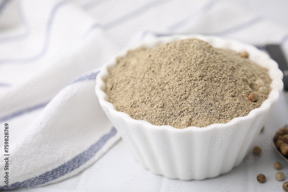 Ground pepper on white tiled table, closeup Ground pepper on white tiled table, closeup