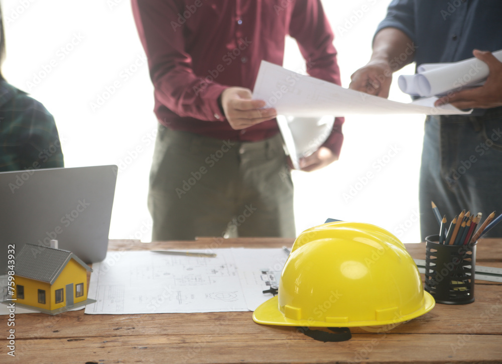 Diverse Team of Specialists Use Laptop on Construction Site. Real Estate Building Project with Engineer Investor and Businessman Checking Area, working on Civil Engineering, Discussing Strategy Plan Diverse Team of Specialists Use Laptop on Construction Site. Real Estate Building Project with Engineer Investor and Businessman Checking Area, working on Civil Engineering, Discussing Strategy Plan