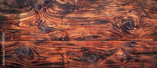 Detailed hardwood surface texture with knots in brown color. photo