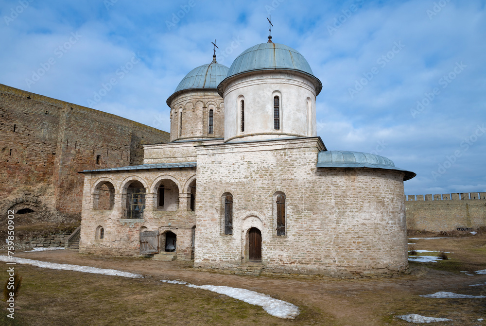 Ancient Church of the Assumption of the Blessed Virgin Mary on a March day. Ivangorod fortress. Russia
