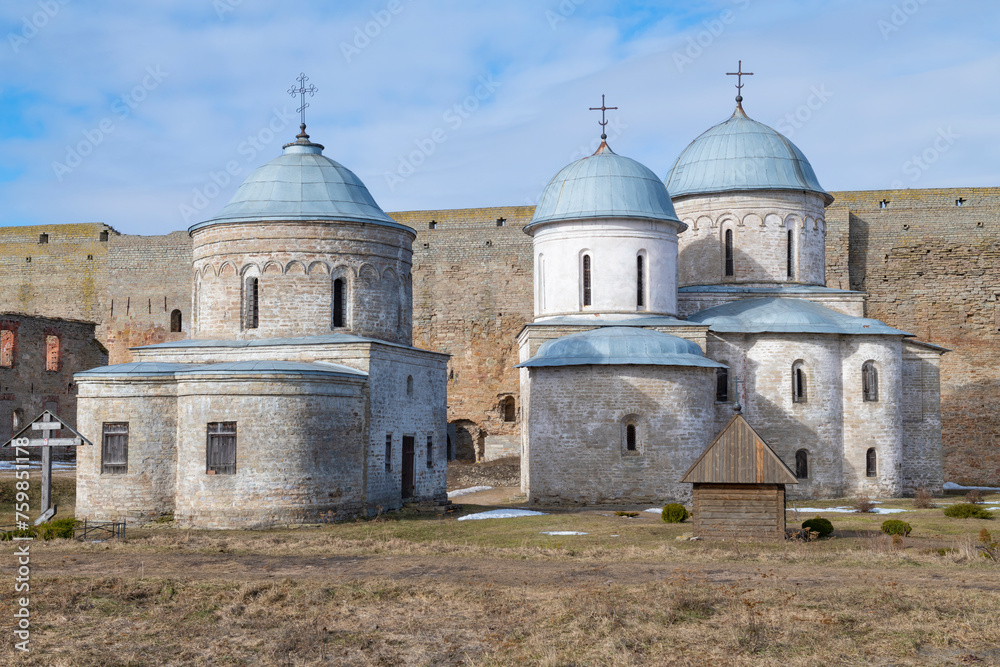 Ancient Assumption Church and St. Nicholas Church on a sunny March day. Ivangorod fortress. Leningrad region, Russia