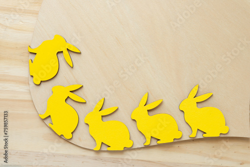 yellow rabbits on a wood shape