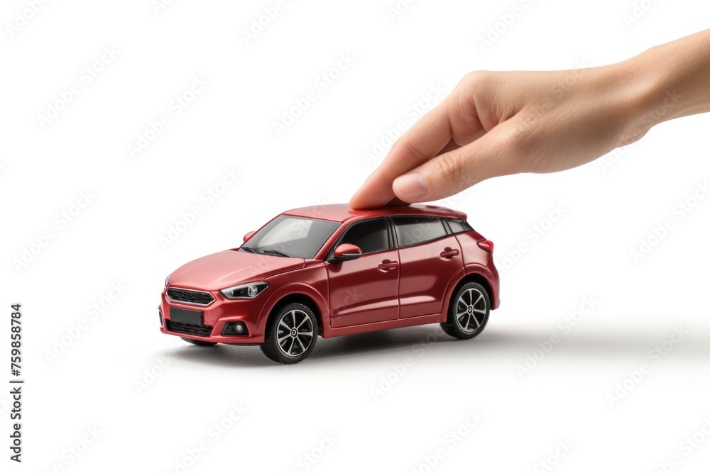 Hand Holding Red Toy Car isolated on white Hand Holding Red Toy Car isolated on white