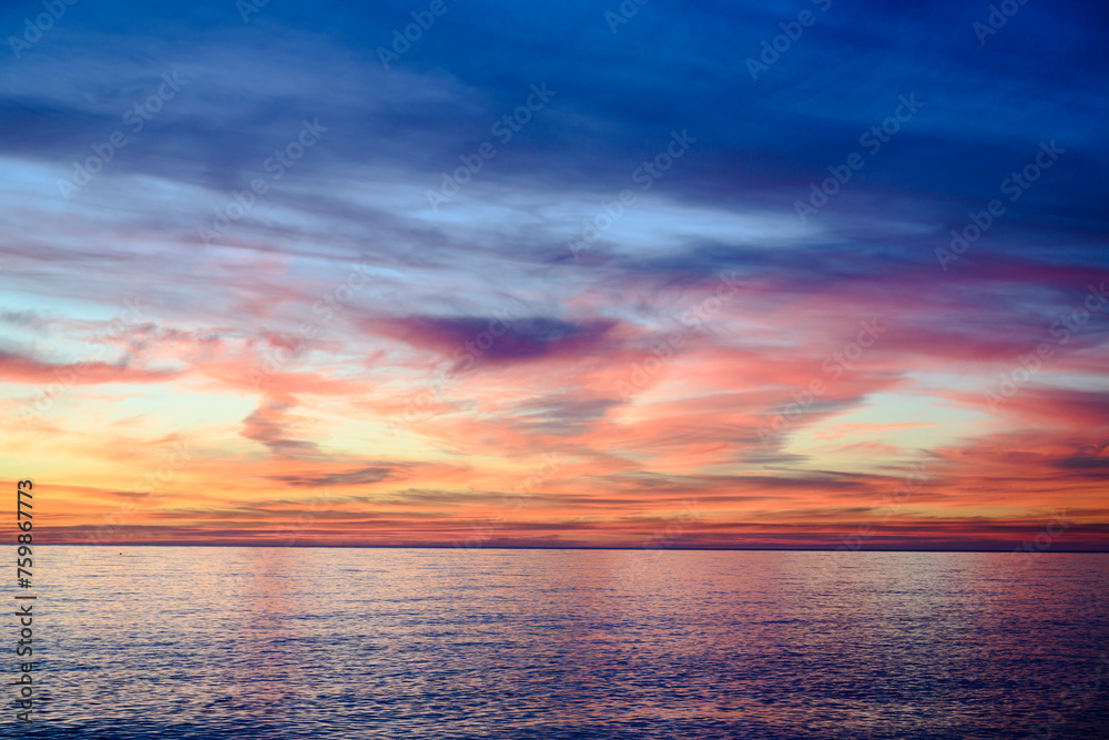 Fototapeta premium Colorful sunset over the winter sea