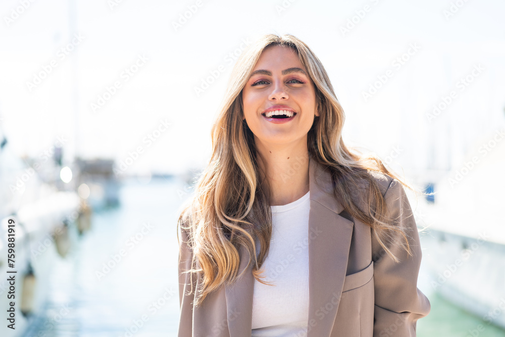Pretty blonde Uruguayan woman With happy expression - obrazy, fototapety, plakaty 