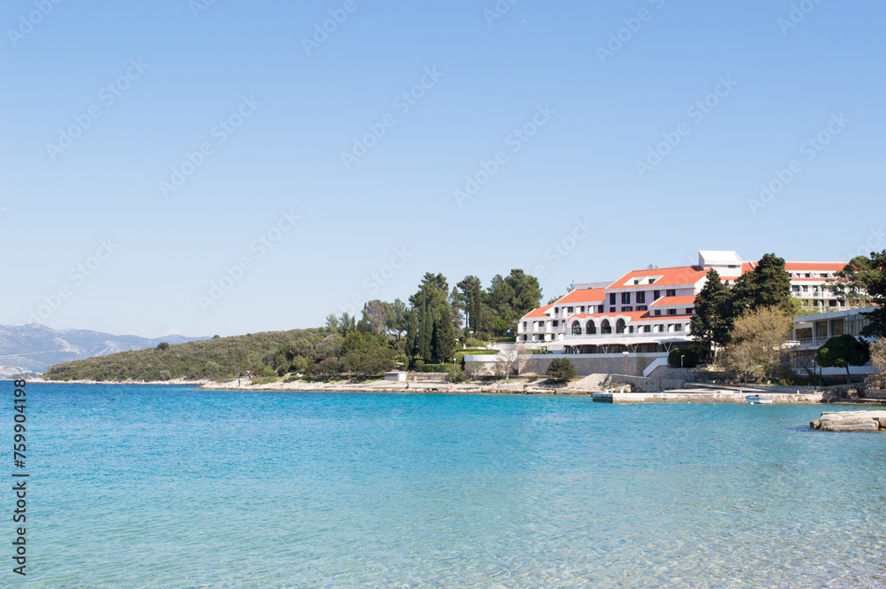 Fototapeta premium Transparent Adriatic sea and hotel accommodation in historic town Korcula in Croatia, summer vacation on Adriatic coast