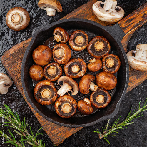 Perfectly Grilled Mushrooms in a cast iron skillet seasoned with Worcestershire sauce, butter, garlic, rosemary, olive oil, salt and red wine