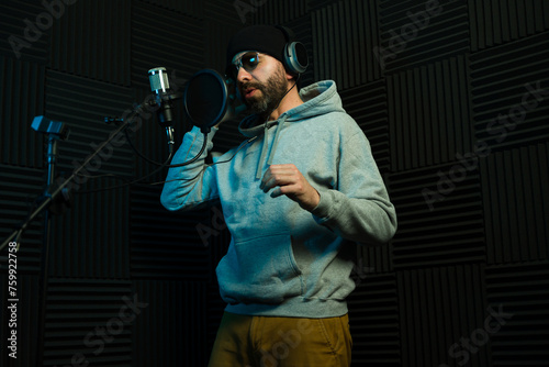 Modern male vocalist recording in studio