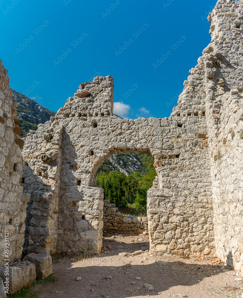 Picturesque ruins of the ancient city of Olympos, in Turkey. Ruins of the ancient city of Olympos near the village of Cirali in Turkey.