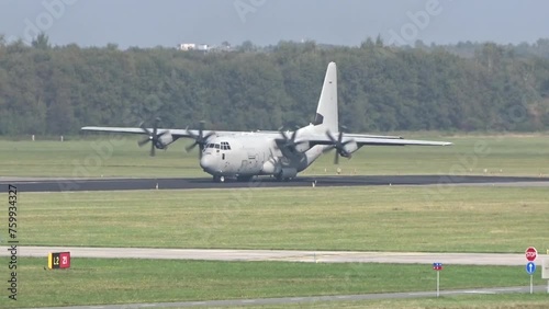 Generic Military Army Transport airplane taxiing on the runway prior take off for a mission evacuation