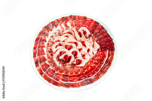 A plate of acorn-fed Iberian ham perfectly cut and presented on a plate on a white background, at an event.