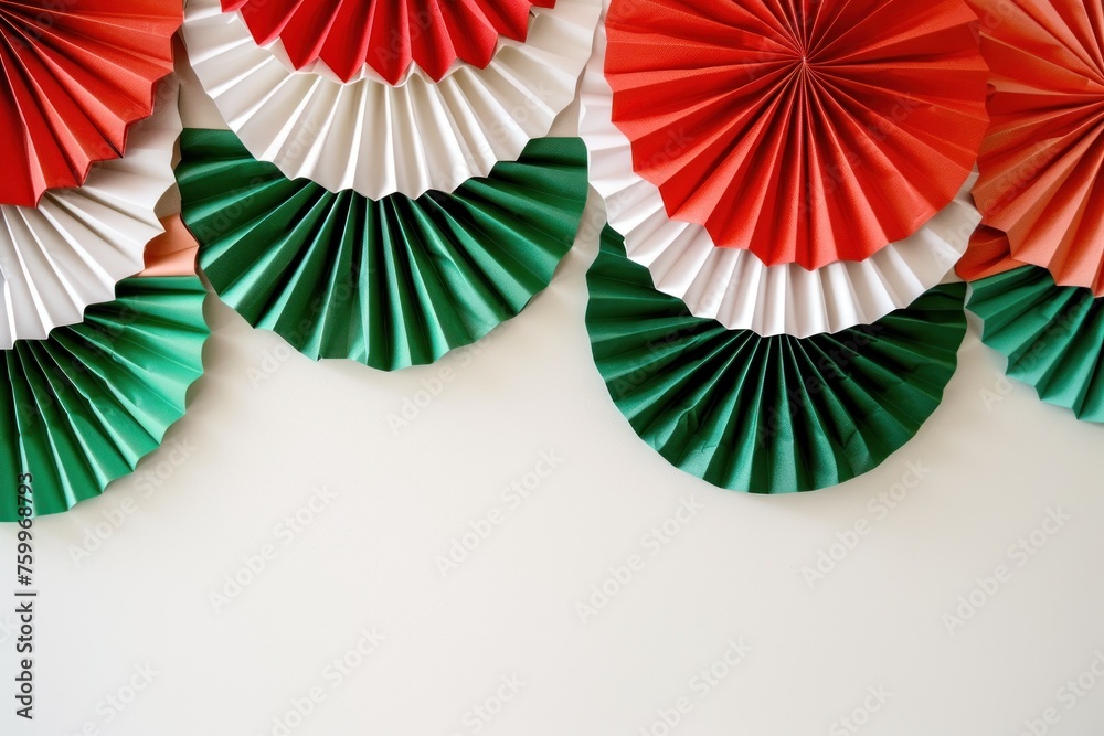 A lush array of paper fan decorations in the colors of the Mexican flag, fitting for party decoration inspiration or promotional materials for Cinco de Mayo celebrations