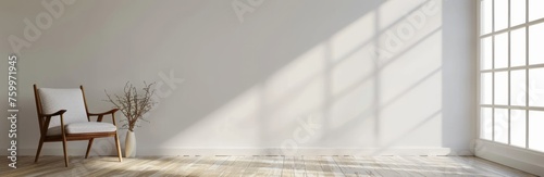Minimalist room with a white wall and wooden floor, featuring an armchair on the left side. Web banner with empty space in the upper right corner photo